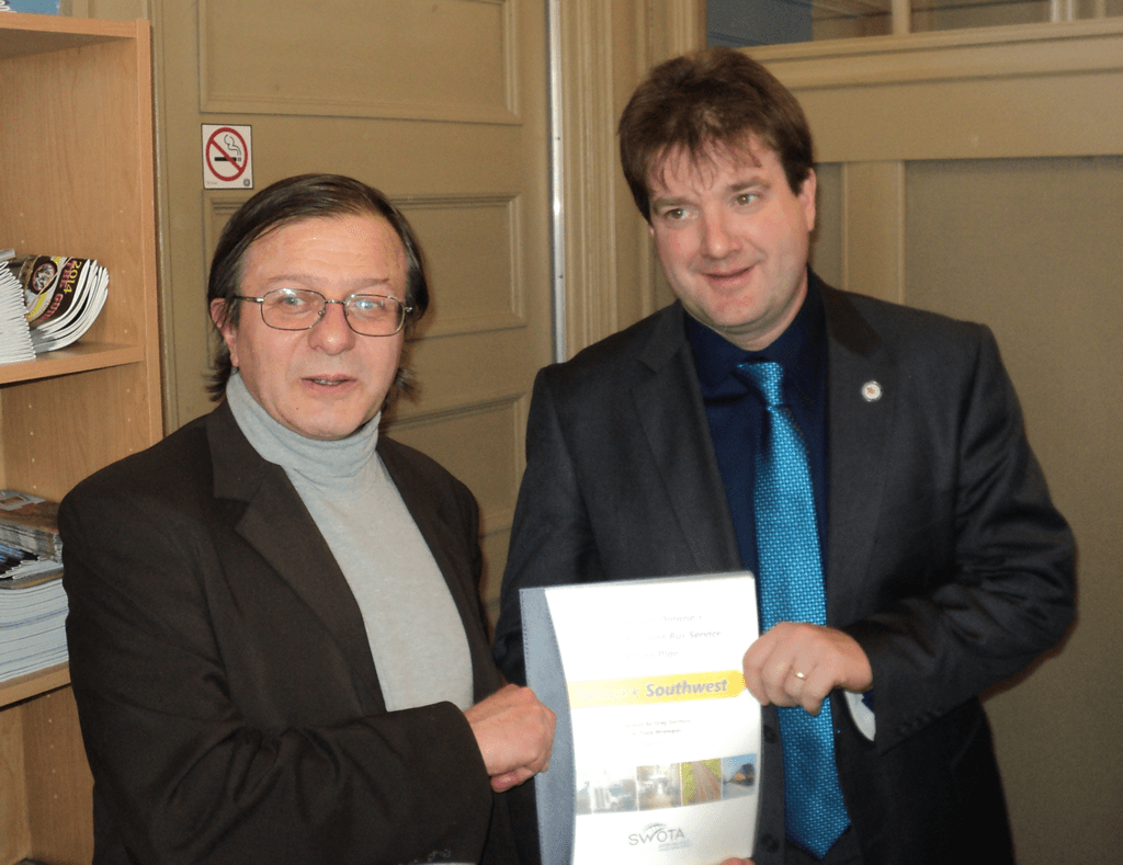 Greg Gormick presents the Network Southwest report to Al Strathdee, Mayor of the Town of St. Marys